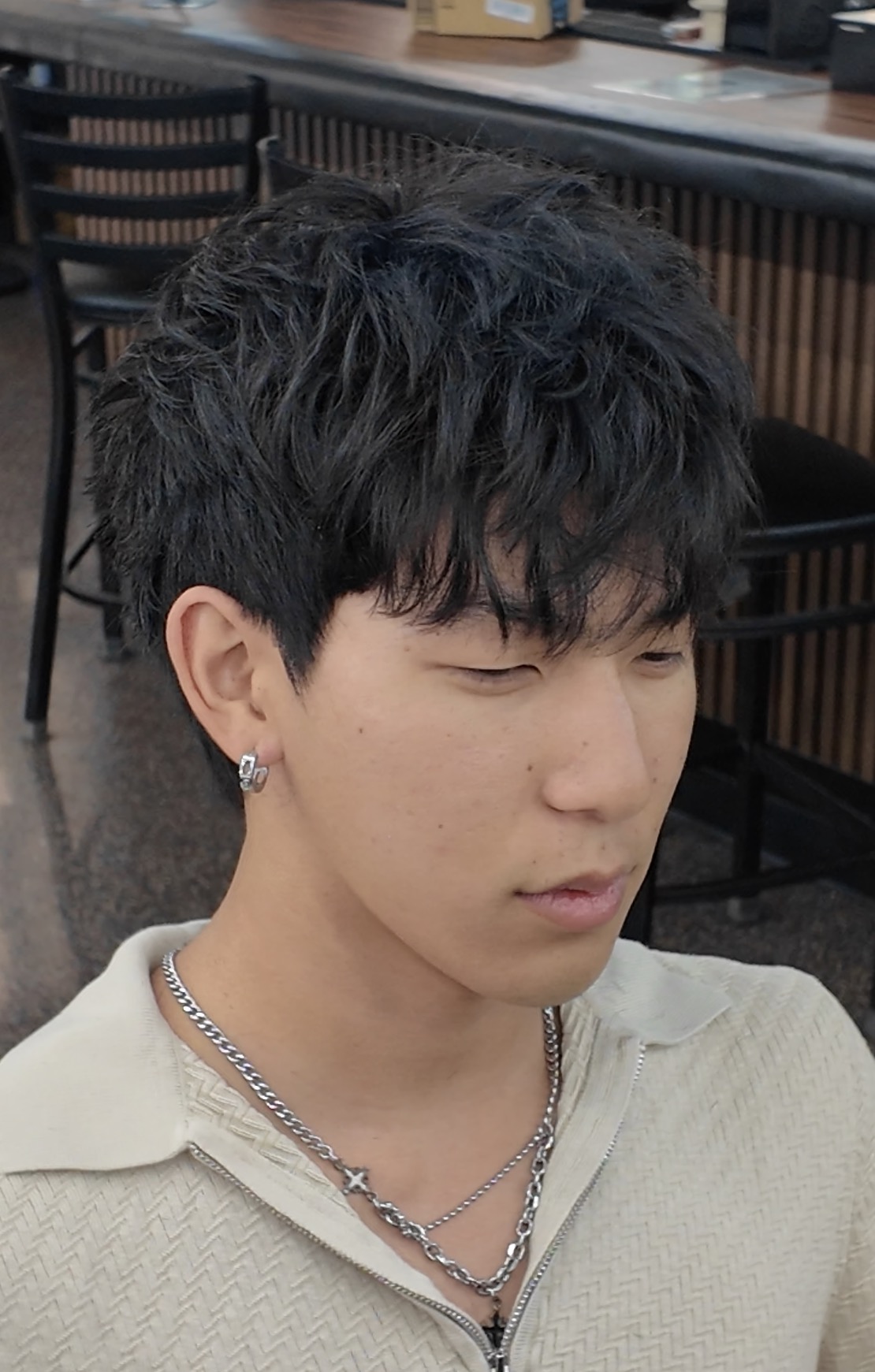 Textured fringe haircut for Asian men's hair at Vintage Barbershop Honolulu